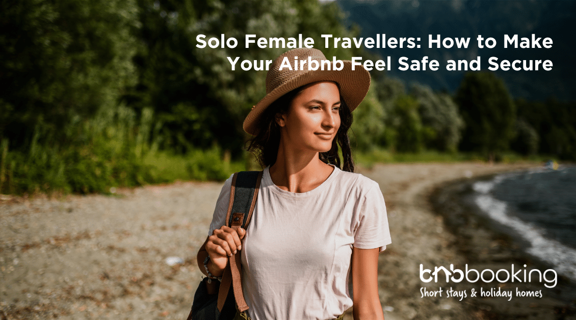 Confident solo female traveller unlocking an Airbnb apartment door with luggage in hand.