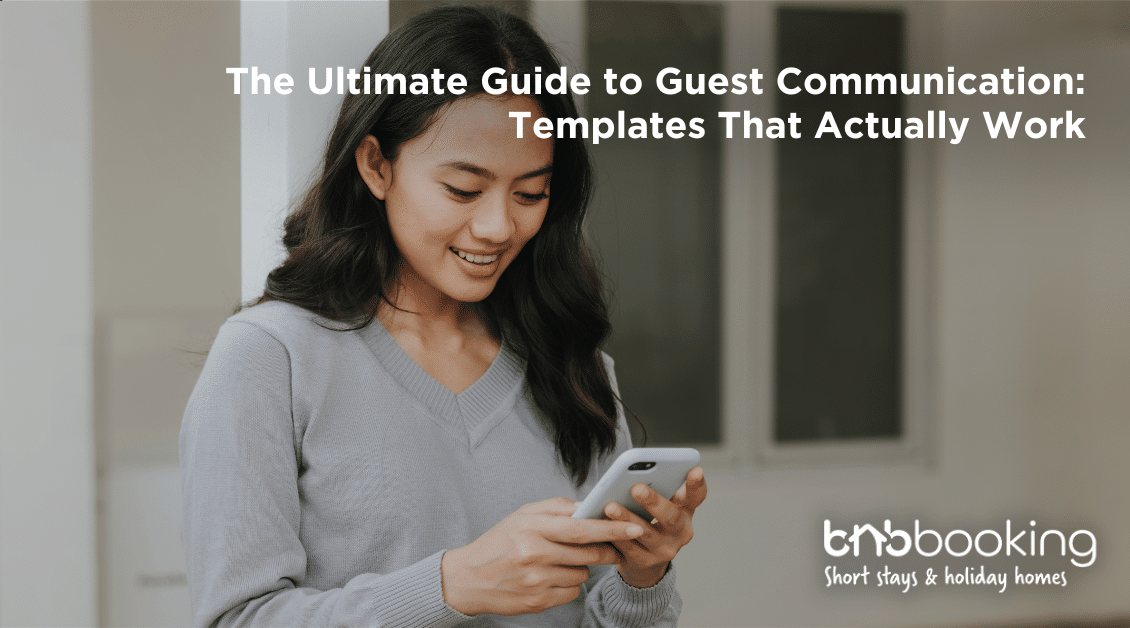 Airbnb host using a laptop to send automated welcome messages to guests before check-in.